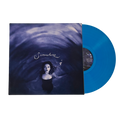 A vinyl record partially pulled from its sleeve, showing a bright translucent blue disc alongside the album cover art featuring a woman in water with the title 'Somewhere' in script.