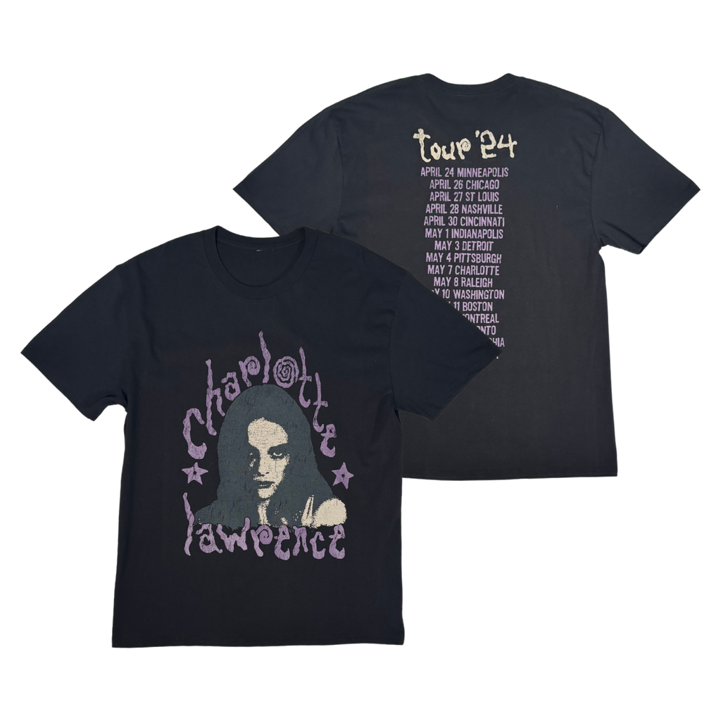 Two black short-sleeve T-shirts shown on a white background, with the front and back views overlapping. The front shirt features a large graphic of a woman's face with the words 'Charlotte Lawrence' in a purple stylized font.